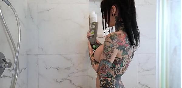 Tattooed hussy showers her rest body after her appetizing boobs