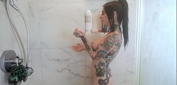 Tattooed hussy showers her rest body after her appetizing boobs
